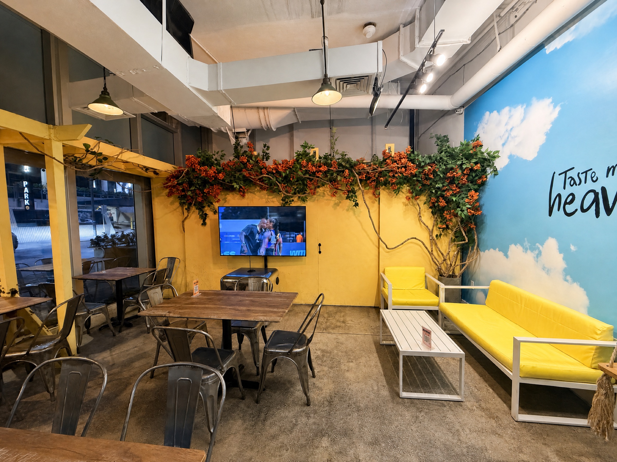 Main dining room with mural and tables, The Cocinita Miami, Brickell